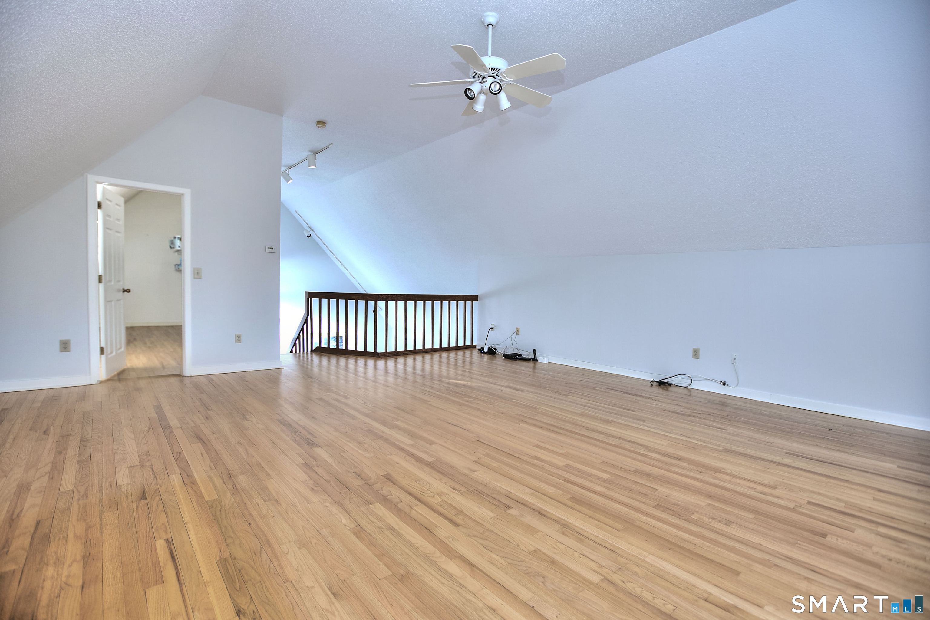 160 Glengarry Road, Unit 160 Fairfield, CT 06825 - Photo 21 of 31 wooden floor in an empty room