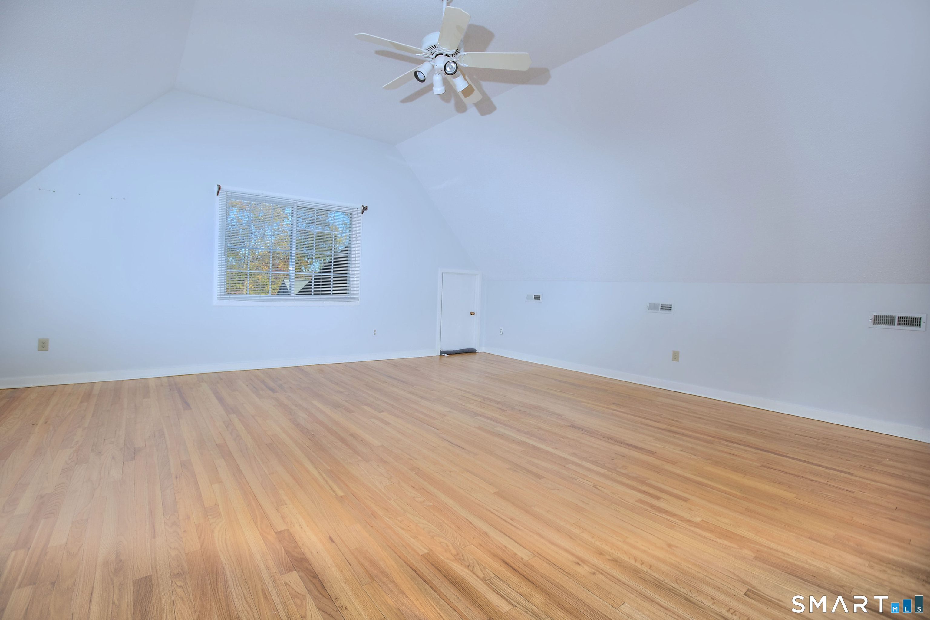 160 Glengarry Road, Unit 160 Fairfield, CT 06825 - Photo 22 of 31 wooden floor in an empty room