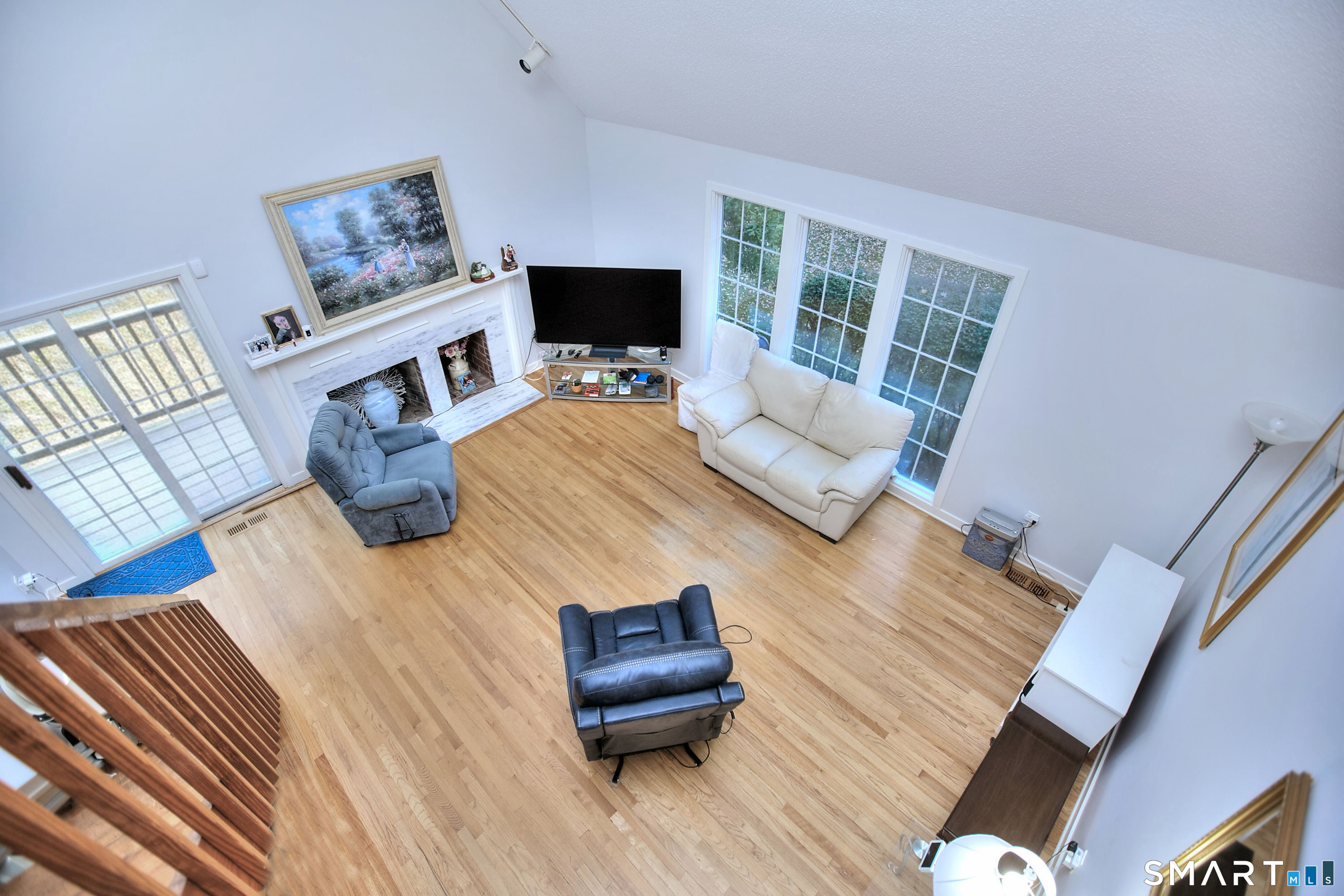 160 Glengarry Road, Unit 160 Fairfield, CT 06825 - Photo 24 of 31 a living room with furniture and a flat screen tv
