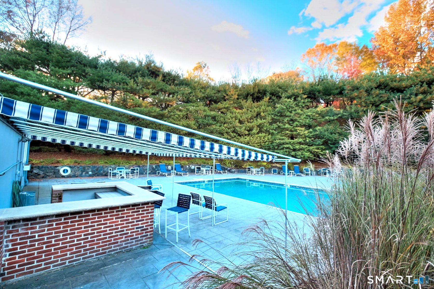 160 Glengarry Road, Unit 160 Fairfield, CT 06825 - Photo 28 of 31 a view of a roof deck with couches chairs and wooden floor