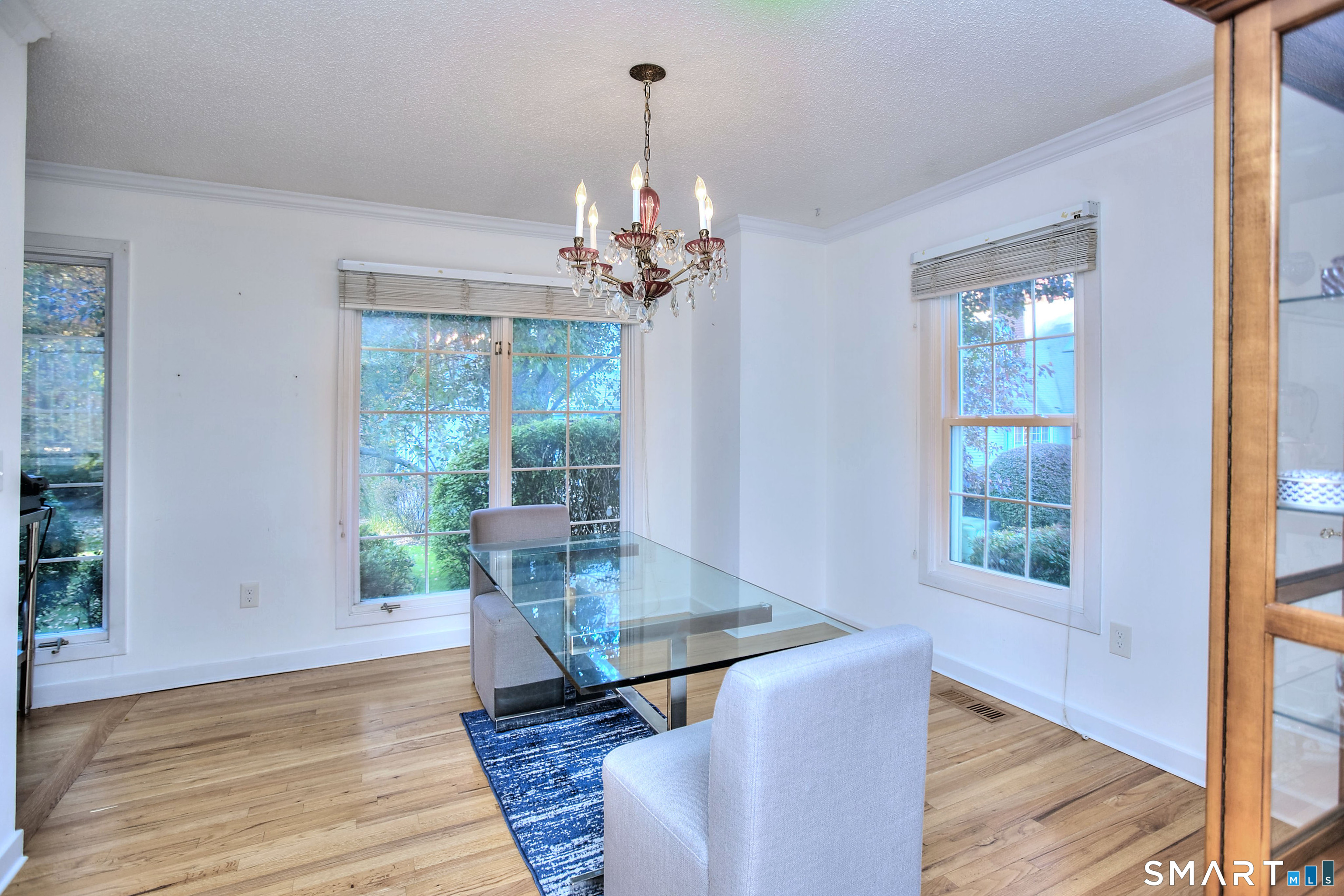 160 Glengarry Road, Unit 160 Fairfield, CT 06825 - Photo 7 of 31 a view of a dining room with furniture window and wooden floor