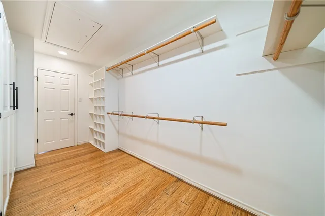 a view of a room with wooden floor and white walls