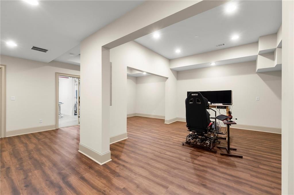 322 Edwards Brook Lane Canton, GA 30115 - Photo 73 of 99 a view of a room with wooden floor and furniture