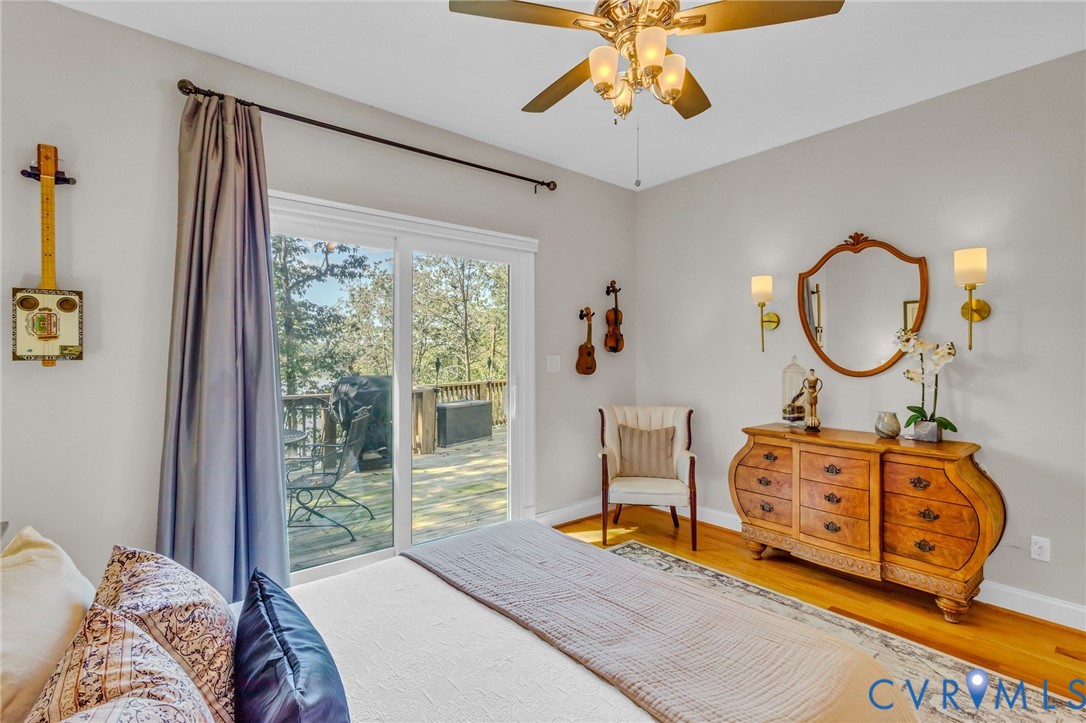 578 High Point Trail Heathsville, VA 22473 - Photo 21 of 50 a bedroom with a bed a dresser and chair