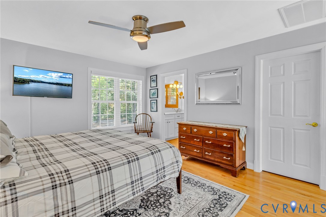 578 High Point Trail Heathsville, VA 22473 - Photo 27 of 50 a bedroom with a bed and a dresser in it