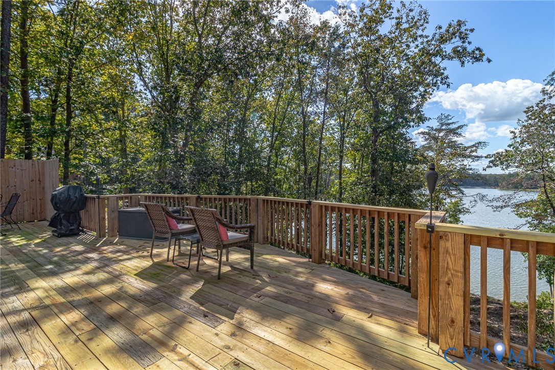 578 High Point Trail Heathsville, VA 22473 - Photo 33 of 50 a view of roof deck with two chairs and wooden fence