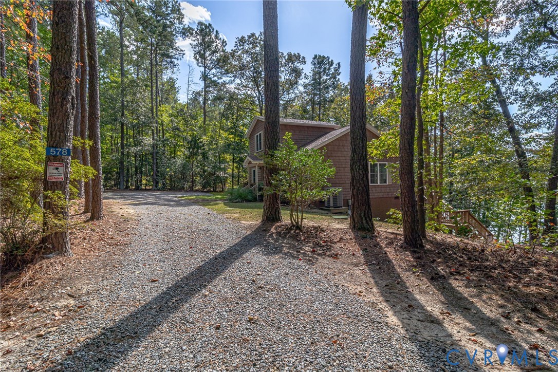 578 High Point Trail Heathsville, VA 22473 - Photo 37 of 50 a view of a yard with plants and trees