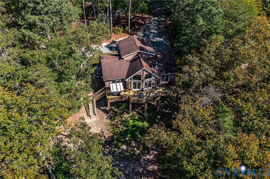 578 High Point Trail Heathsville, VA 22473 - Photo 43 of 50 a backyard of a house with table and chairs