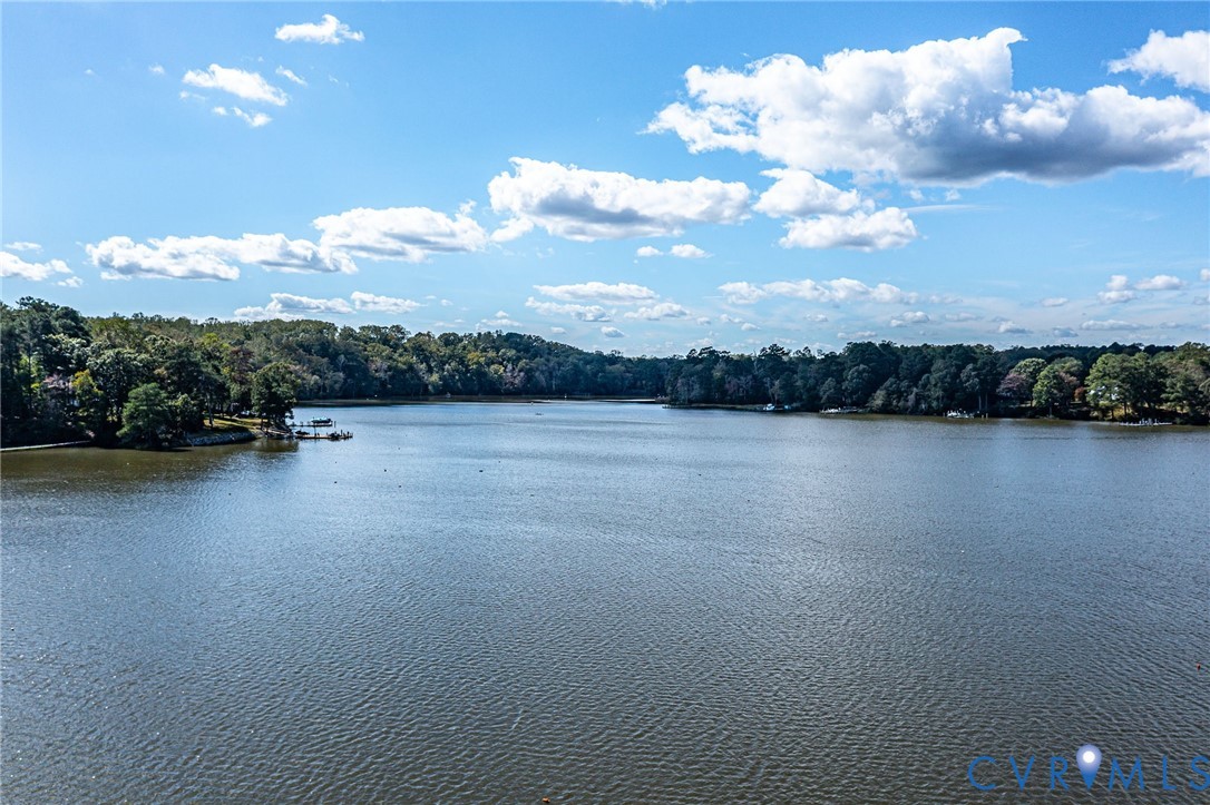 578 High Point Trail Heathsville, VA 22473 - Photo 44 of 50 a view of a lake with houses in back