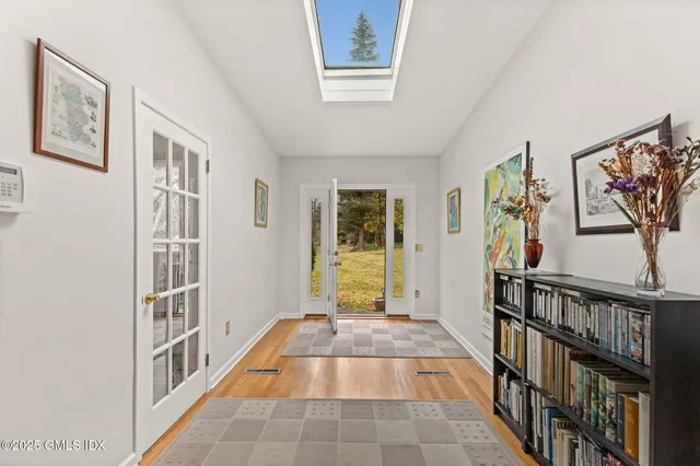 a view of an entryway with wooden floor