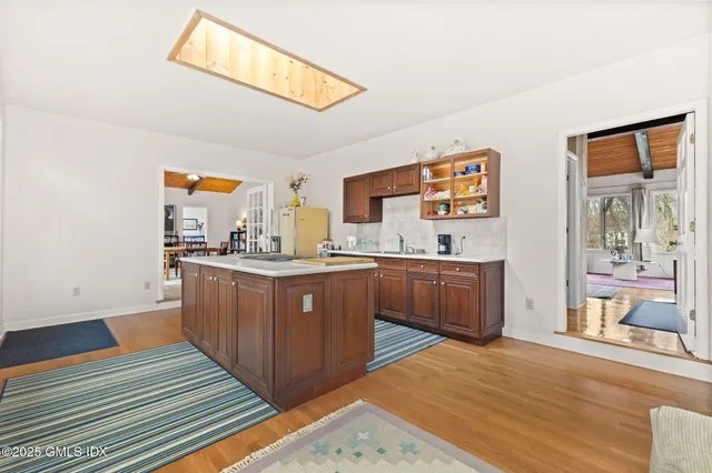 a kitchen with stainless steel appliances granite countertop a sink and cabinets