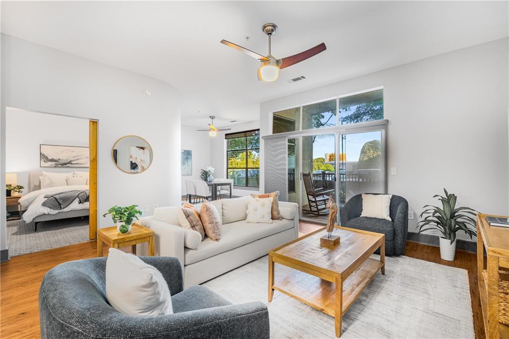 a living room with furniture and a large window