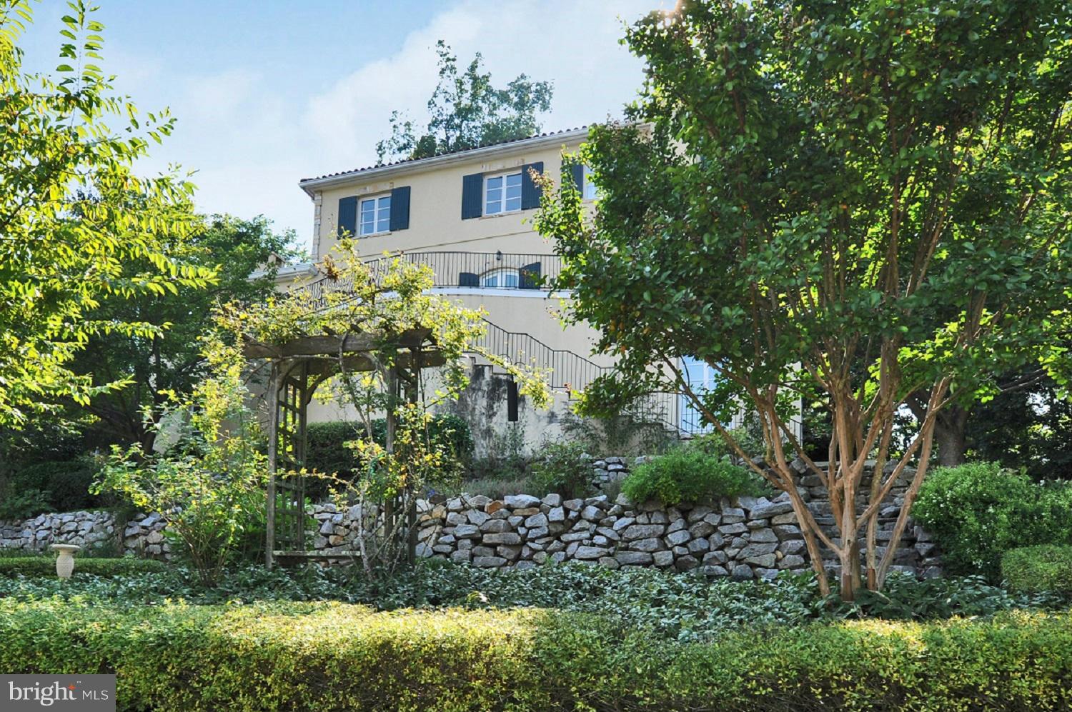 7608 Southdown Road Alexandria, VA 22308 - Photo 2 of 30 a house with trees in front of it