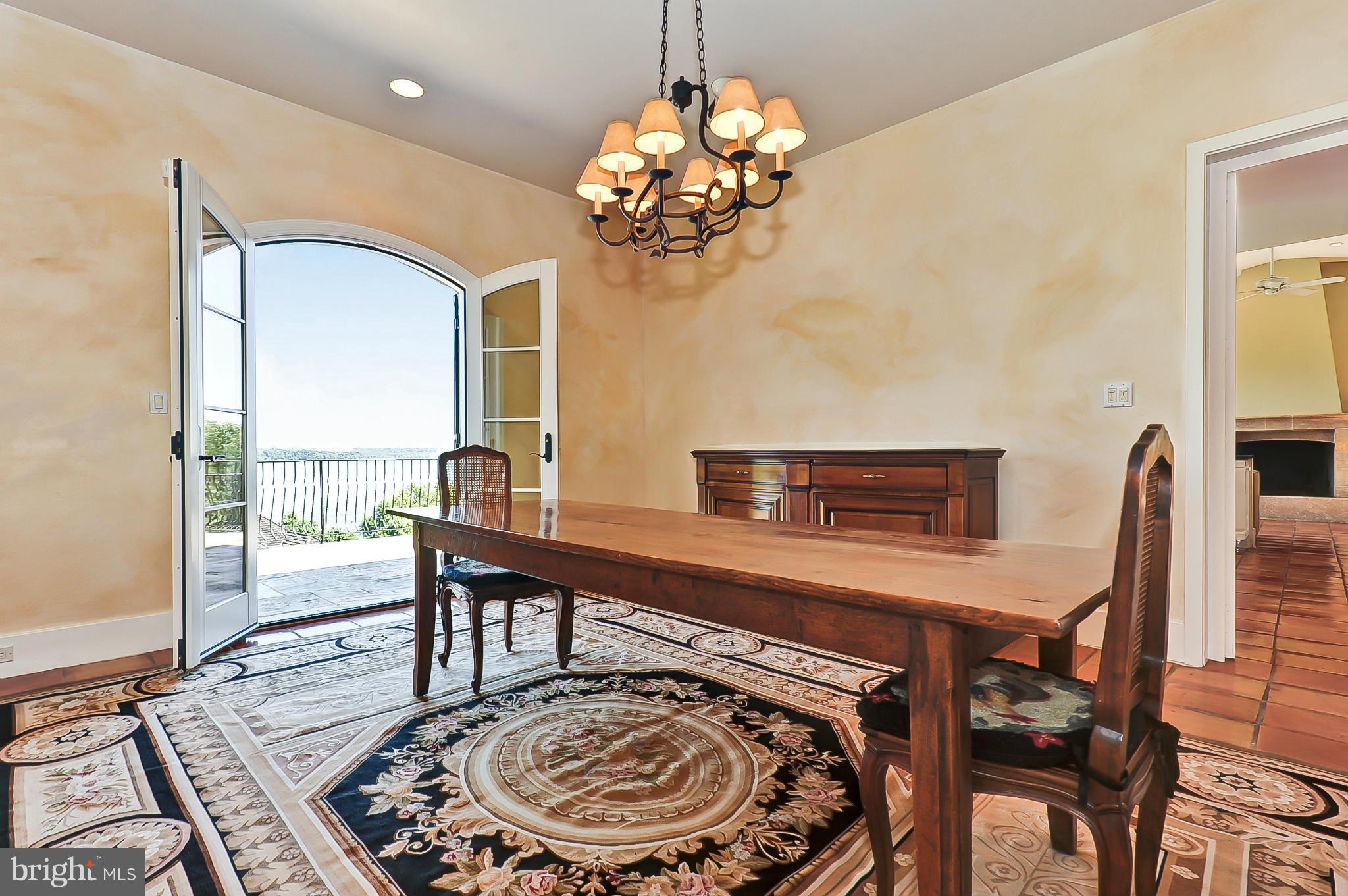 7608 Southdown Road Alexandria, VA 22308 - Photo 16 of 30 a view of a dining room with furniture and a chandelier
