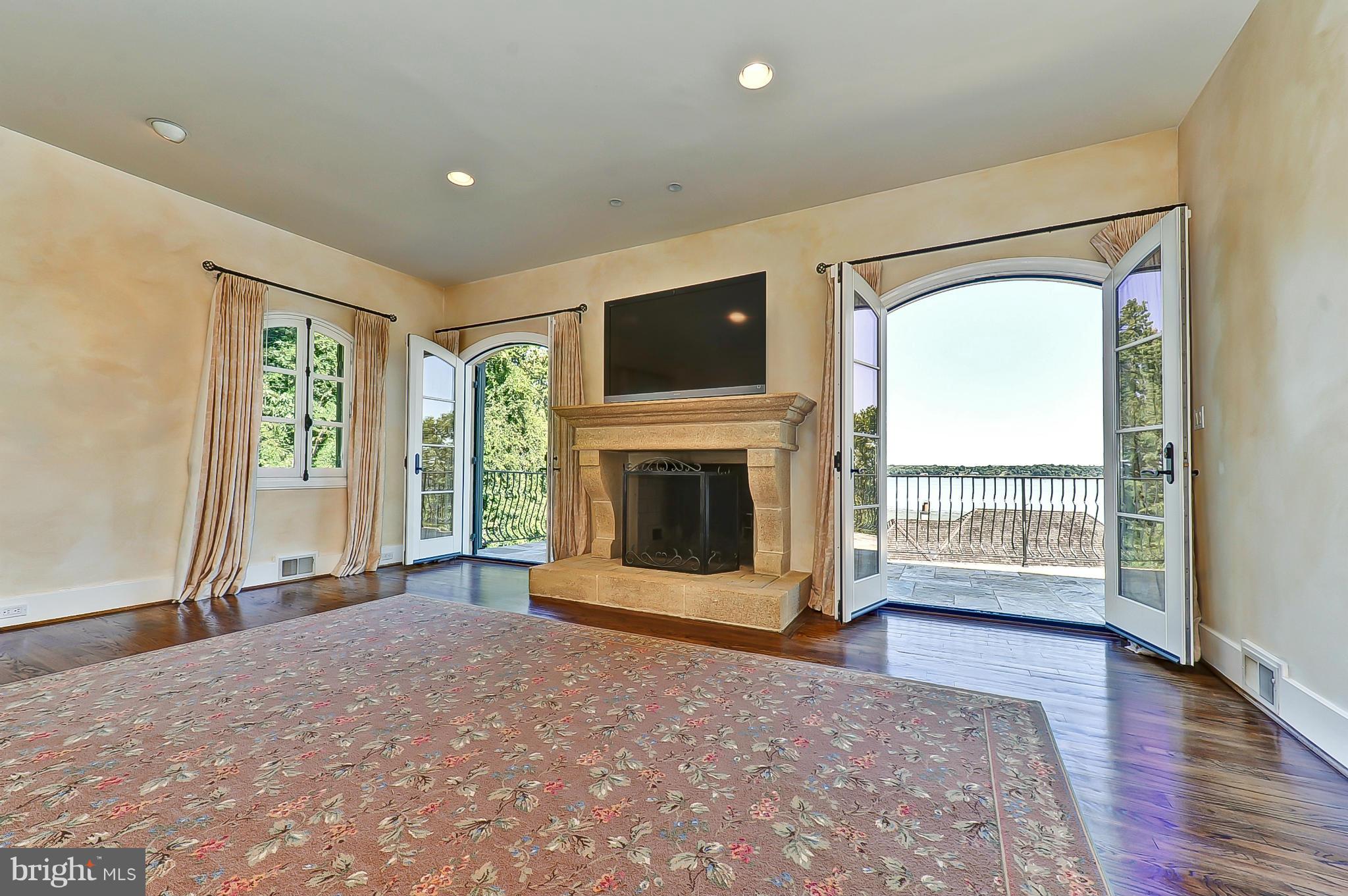 7608 Southdown Road Alexandria, VA 22308 - Photo 18 of 30 a view of a livingroom with a fireplace and window