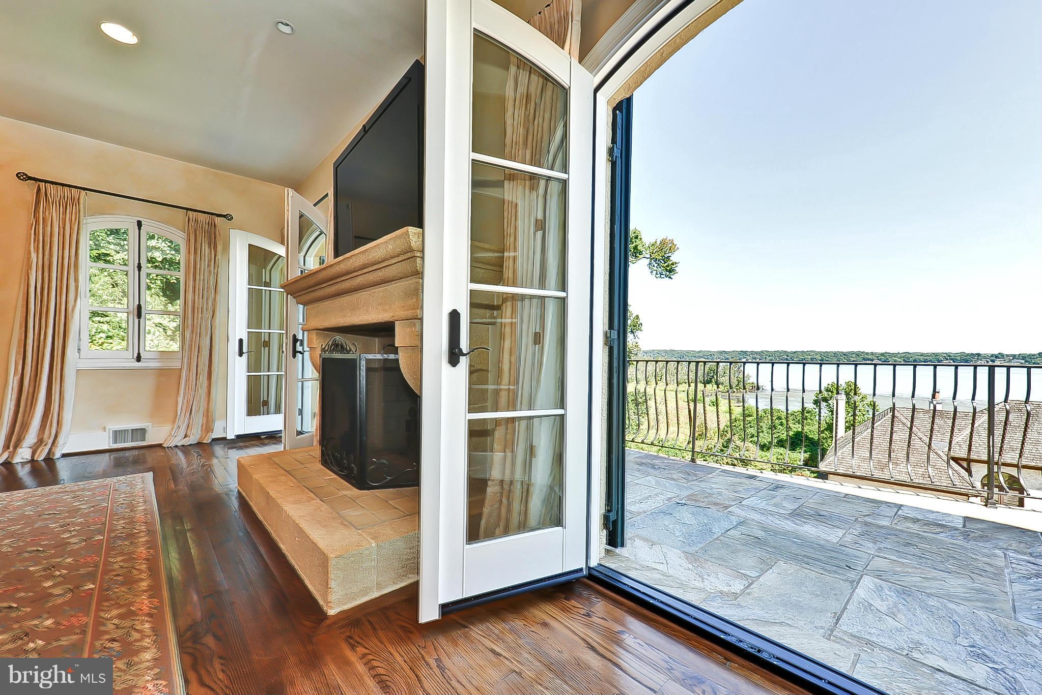 7608 Southdown Road Alexandria, VA 22308 - Photo 19 of 30 a view of a balcony with wooden floor and garden