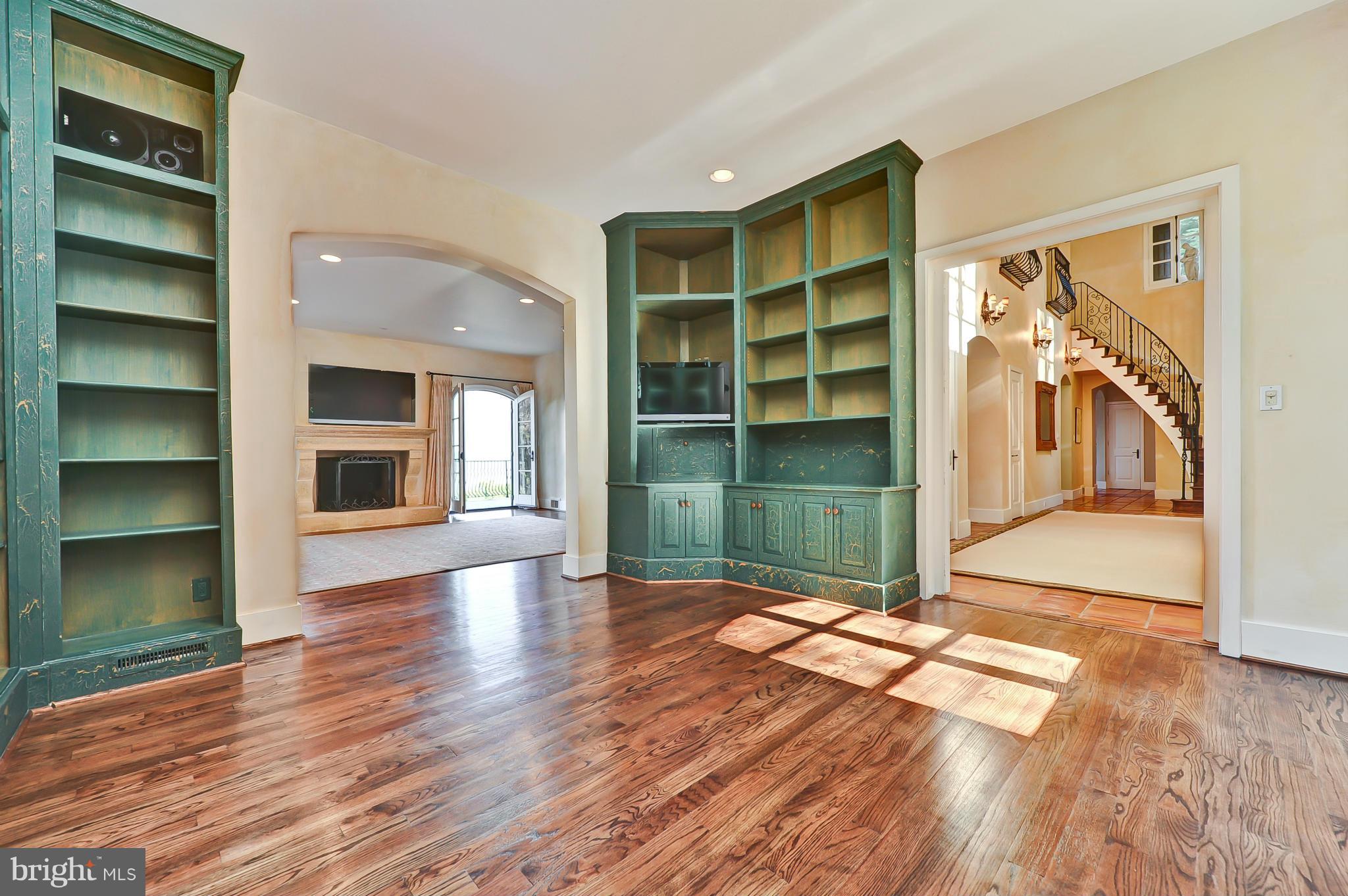 7608 Southdown Road Alexandria, VA 22308 - Photo 20 of 30 a view of an empty room with wooden floor and a window