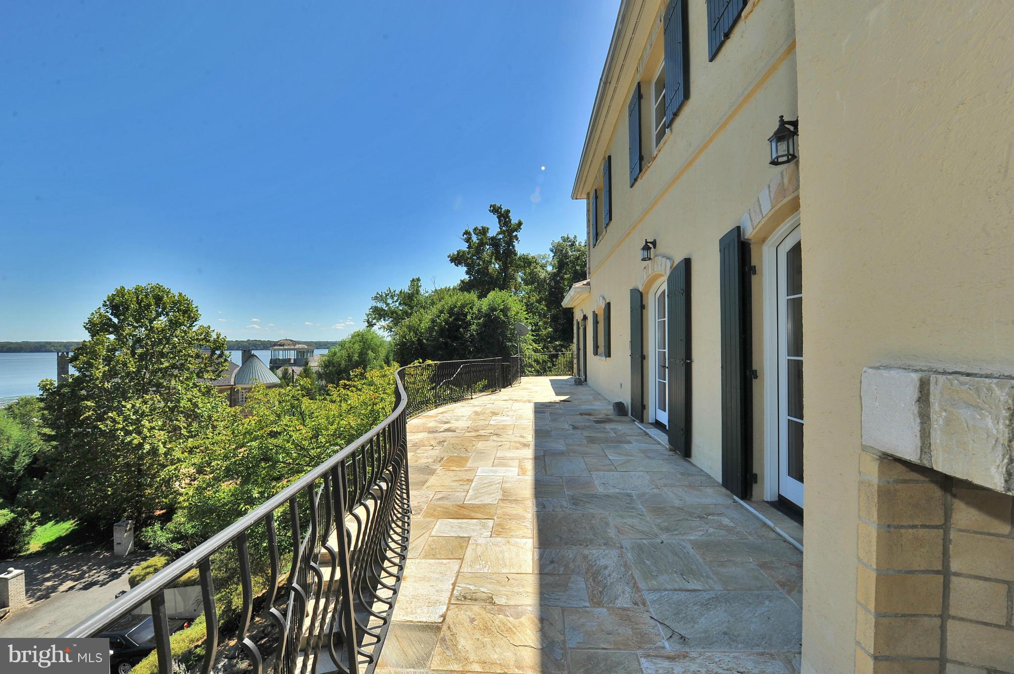 7608 Southdown Road Alexandria, VA 22308 - Photo 3 of 30 a view of a house with balcony and stairs
