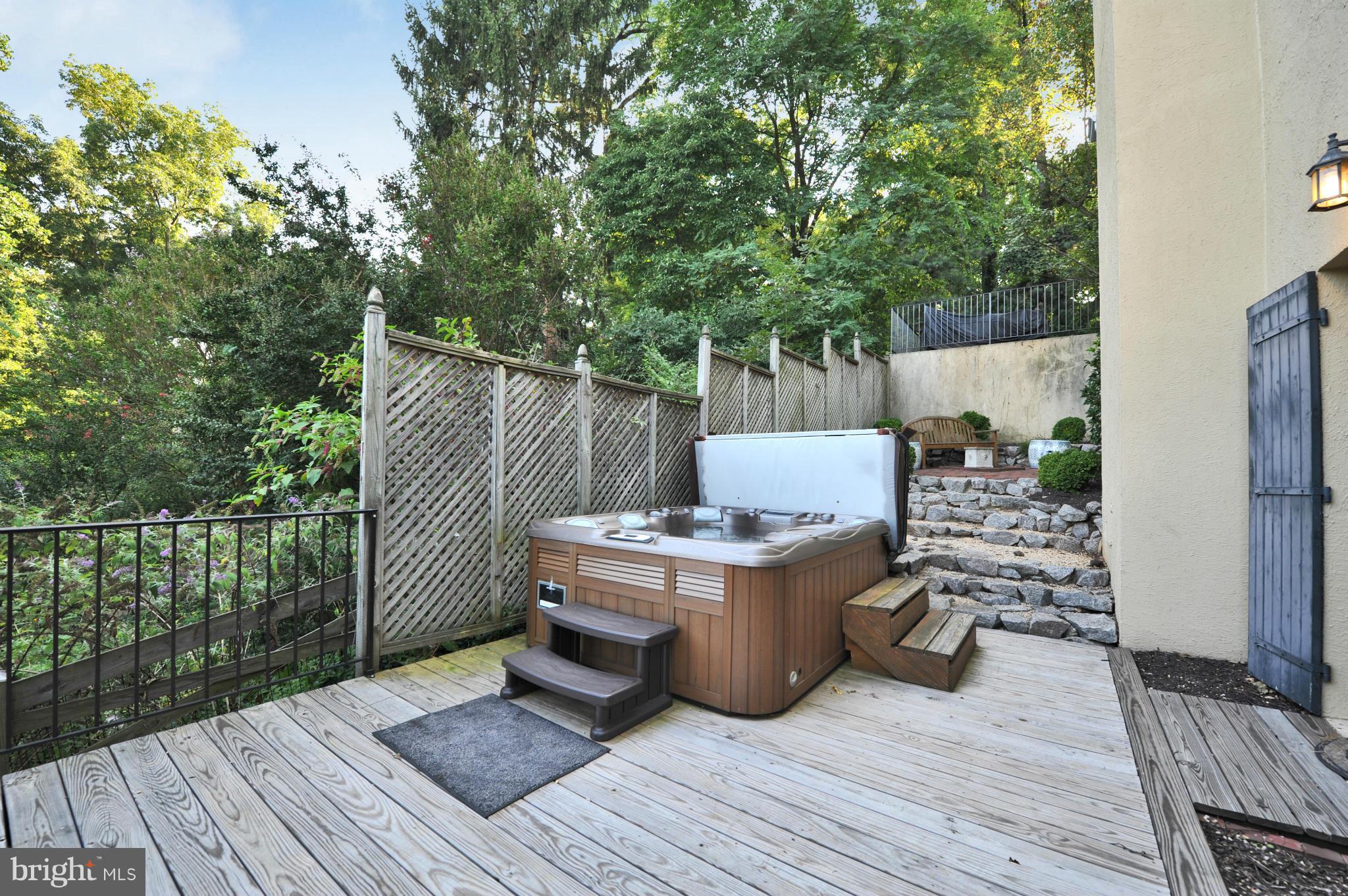 7608 Southdown Road Alexandria, VA 22308 - Photo 29 of 30 a view of a deck with wooden floor and outdoor seating