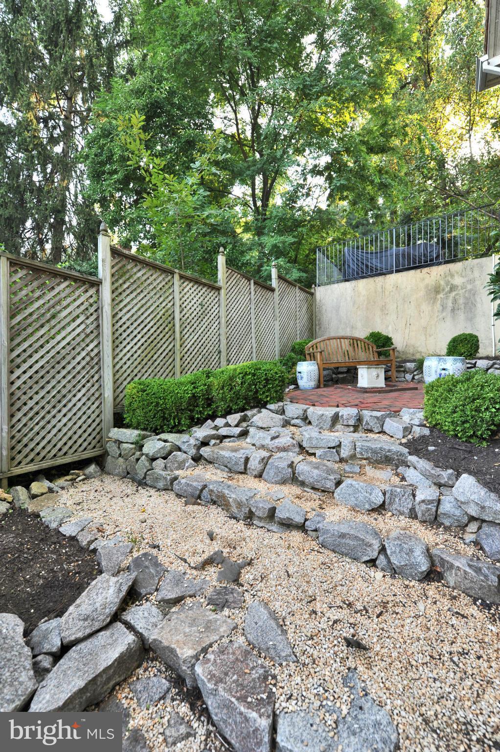 7608 Southdown Road Alexandria, VA 22308 - Photo 30 of 30 a backyard of a house with lots of green space