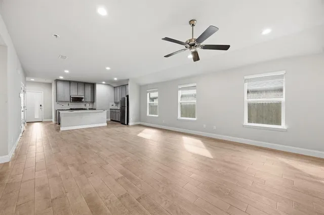 a view of a kitchen with a sink and a window