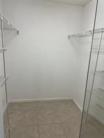 a view of a room with racks on the wall