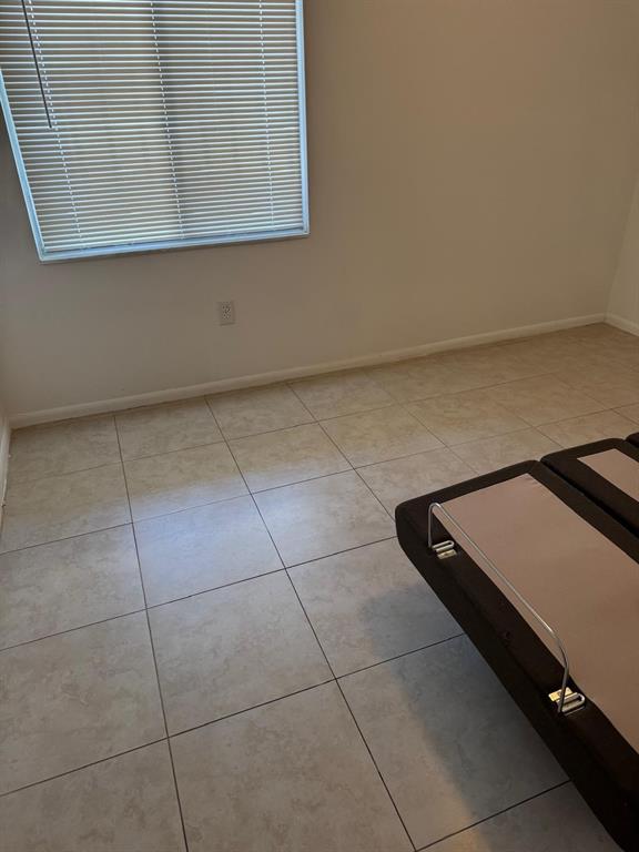 12551 Southwest 16th Court, Unit 306C Pembroke Pines, FL 33027 - Photo 13 of 16 a view of a room with an oven
