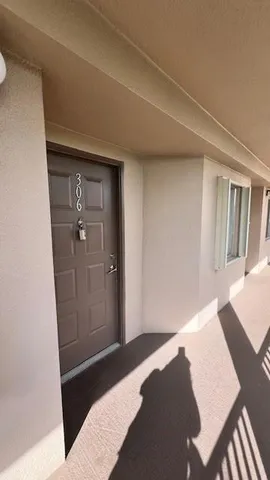 a bedroom with a bed and a mirror