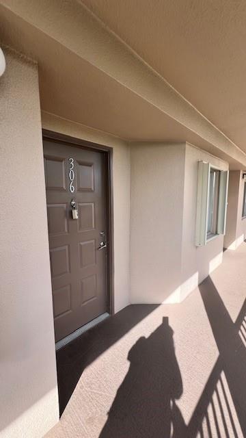 12551 Southwest 16th Court, Unit 306C Pembroke Pines, FL 33027 - Photo 3 of 16 a bedroom with a bed and a mirror