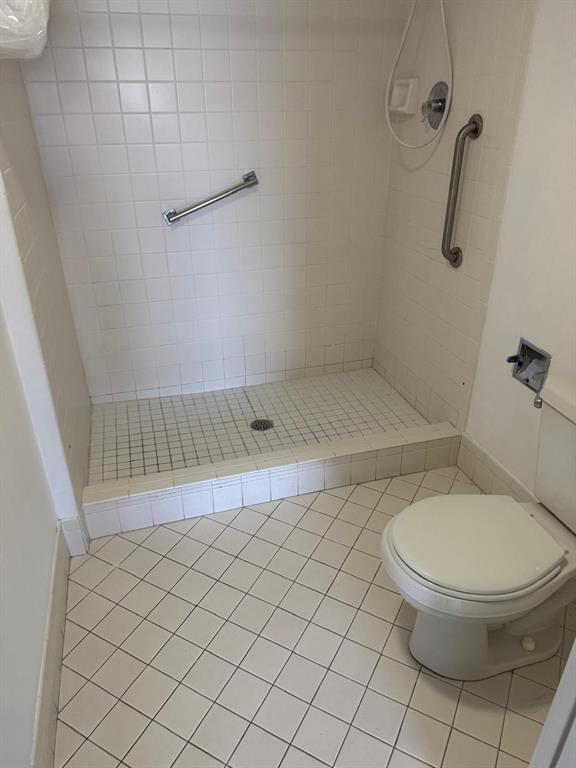 12551 Southwest 16th Court, Unit 306C Pembroke Pines, FL 33027 - Photo 9 of 16 a bathroom with a toilet and a shower
