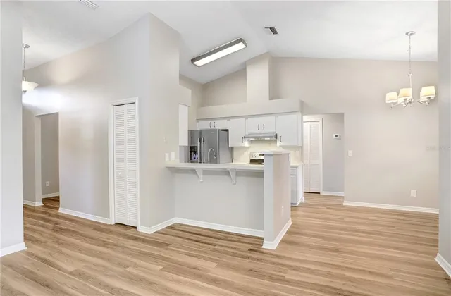 a view of kitchen with wooden floor
