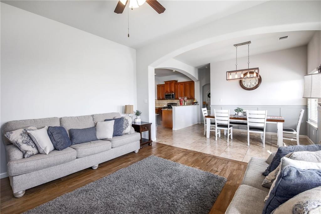 4640 Tiddle Lane Pflugerville, TX 78660 - Photo 4 of 21 a living room with furniture wooden floor and a table