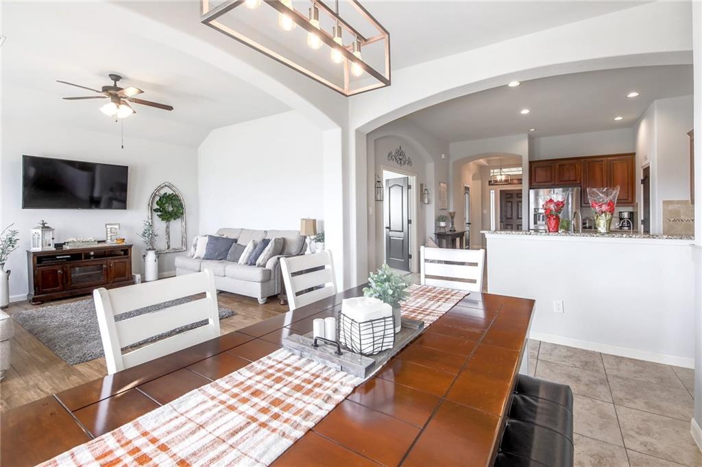 4640 Tiddle Lane Pflugerville, TX 78660 - Photo 6 of 21 a living room with furniture and a flat screen tv
