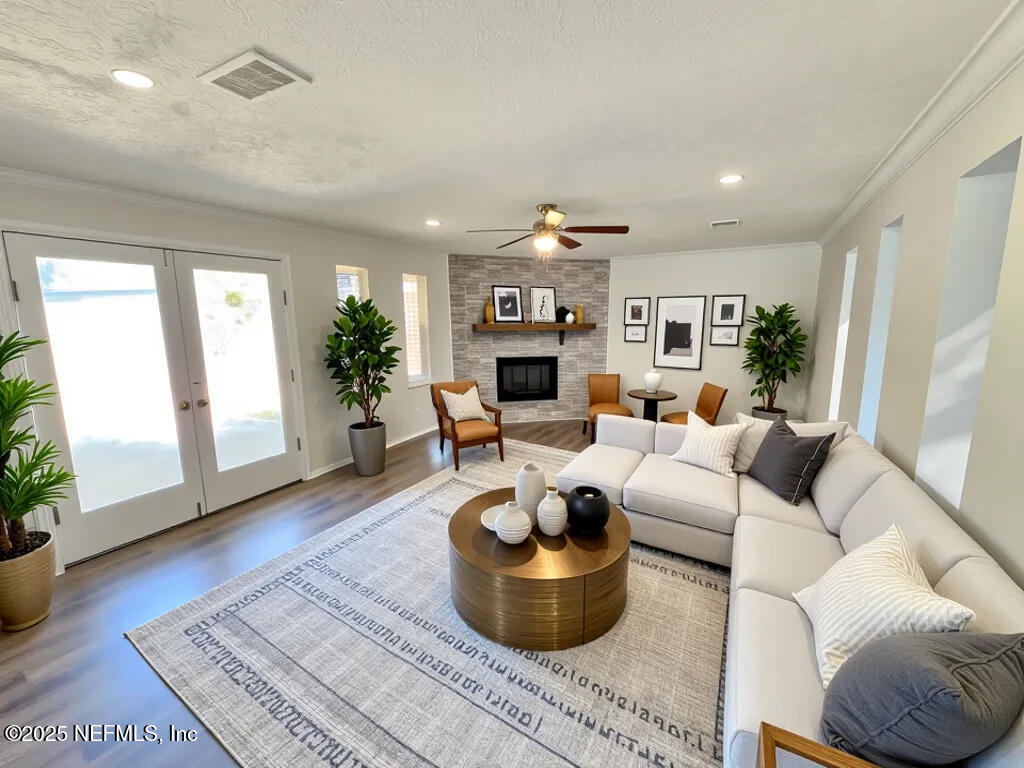 11547 Emuness Road Jacksonville, FL 32218 - Photo 4 of 16 a living room with furniture or couch and a fireplace