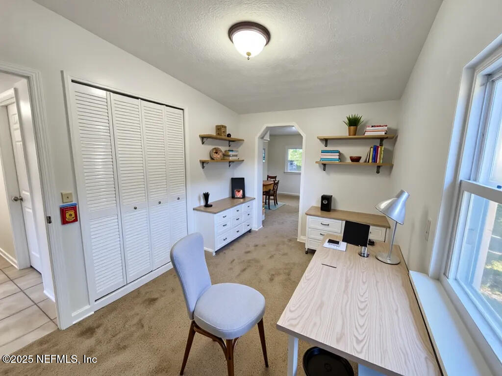 11547 Emuness Road Jacksonville, FL 32218 - Photo 5 of 16 a living room with furniture and a table