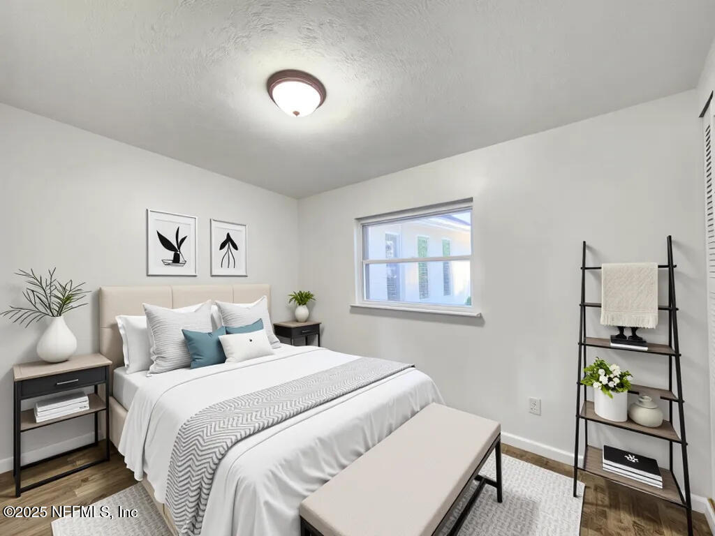 11547 Emuness Road Jacksonville, FL 32218 - Photo 7 of 16 a bedroom with a bed and a window