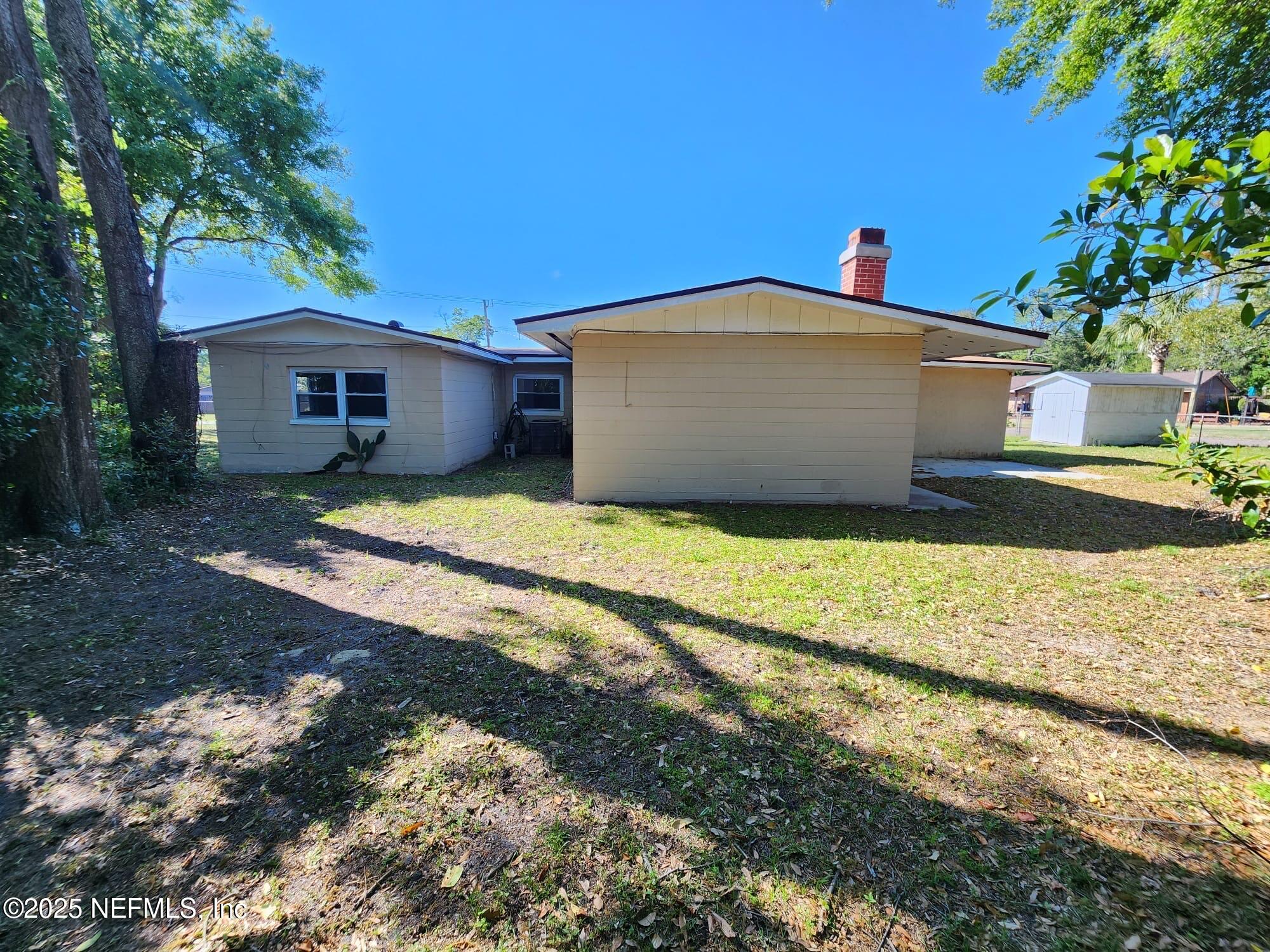 11547 Emuness Road Jacksonville, FL 32218 - Photo 9 of 16 a view of a house with a yard
