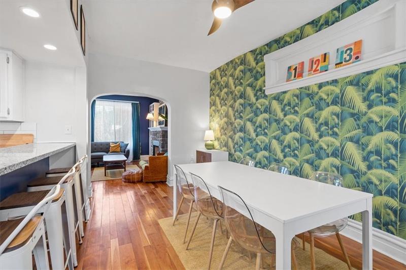 89 Craighead Street Pittsburgh, PA 15211 - Photo 11 of 29 a view of a dining room with furniture wooden floor and a chandelier