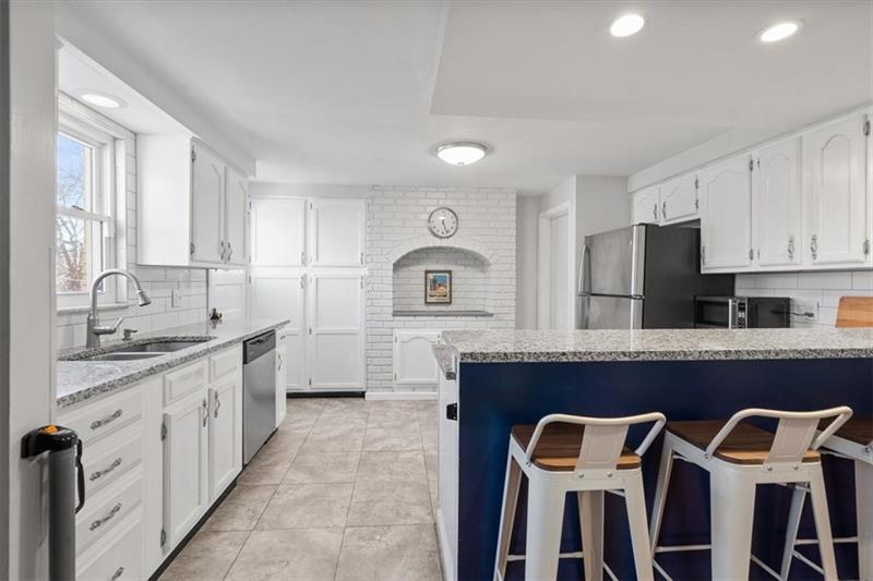 89 Craighead Street Pittsburgh, PA 15211 - Photo 14 of 29 a kitchen with granite countertop a sink and cabinets