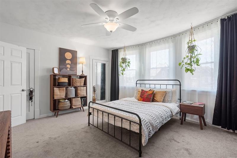 89 Craighead Street Pittsburgh, PA 15211 - Photo 19 of 29 a bedroom with a bed furniture and a window