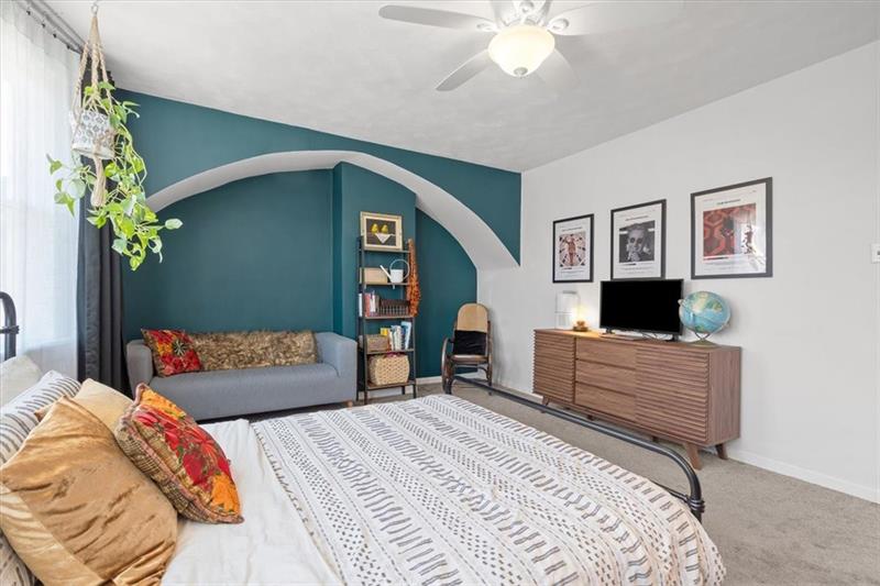 89 Craighead Street Pittsburgh, PA 15211 - Photo 22 of 29 a bedroom with a bed and a dresser