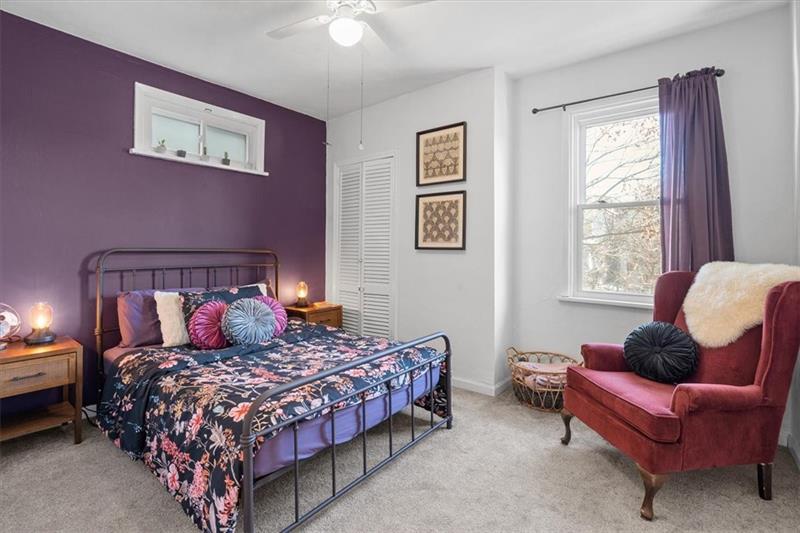 89 Craighead Street Pittsburgh, PA 15211 - Photo 25 of 29 a bedroom with a bed and chair