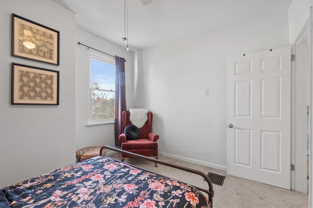 89 Craighead Street Pittsburgh, PA 15211 - Photo 26 of 29 a living room with a couch and a window