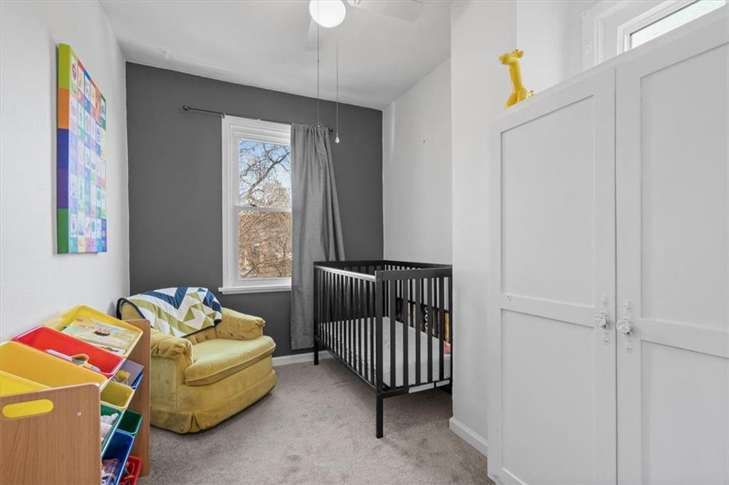 89 Craighead Street Pittsburgh, PA 15211 - Photo 27 of 29 a bedroom with a bed and a window