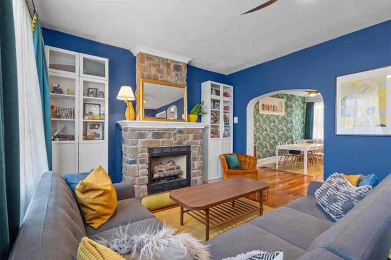 89 Craighead Street Pittsburgh, PA 15211 - Photo 6 of 29 a living room with furniture fireplace and a window