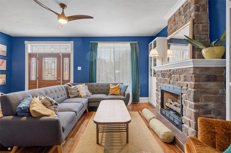 89 Craighead Street Pittsburgh, PA 15211 - Photo 8 of 29 a living room with furniture and a fireplace