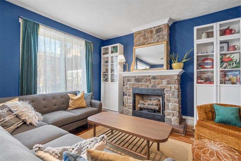 89 Craighead Street Pittsburgh, PA 15211 - Photo 9 of 29 a living room with furniture and a fireplace