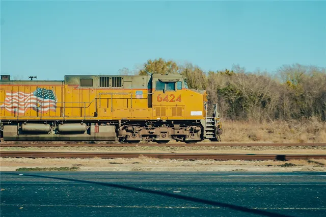 a view of a backyard with chairs
