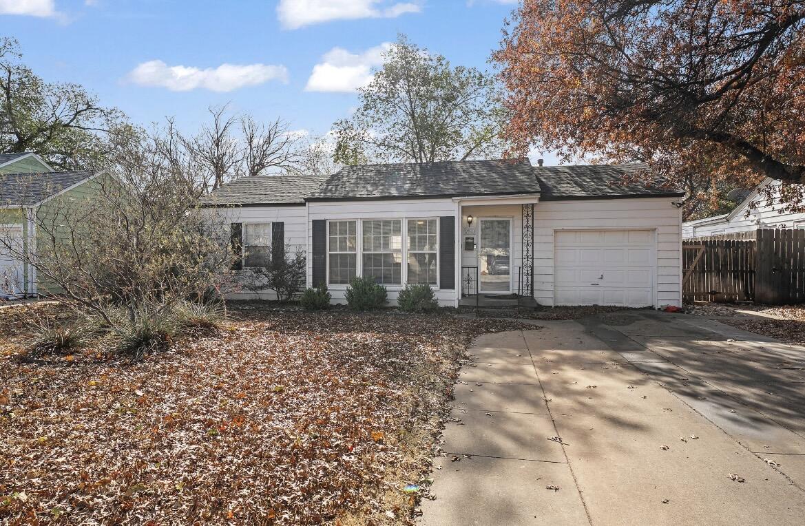 2511 28th Street Lubbock, TX 79410 - Photo 1 of 15 a view of a house with a yard and large tree