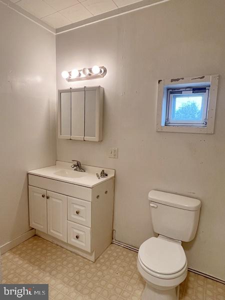 6 York Street, Unit F Manchester, PA 17345 - Photo 6 of 7 a bathroom with a toilet a sink and mirror